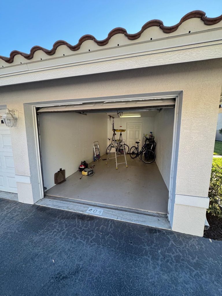 General Repair & Installition | Garage Door Repair Fort Myers 6 Garage interior with bicycles, ladder, and tools, showcasing a well-maintained space emphasizing garage door functionality and security.
